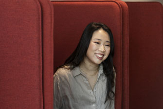 Female student on campus couch