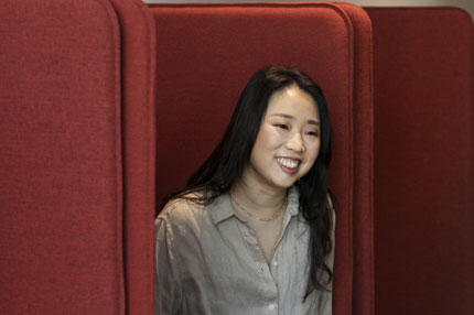 Female student on campus couch