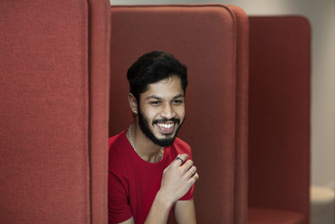 Male student on campus couch