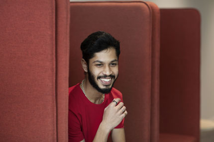 Male student on campus couch