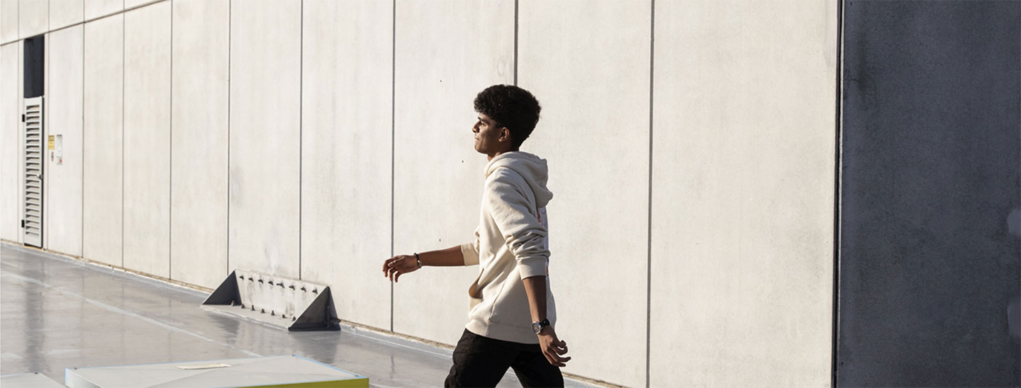 Male student walking outside