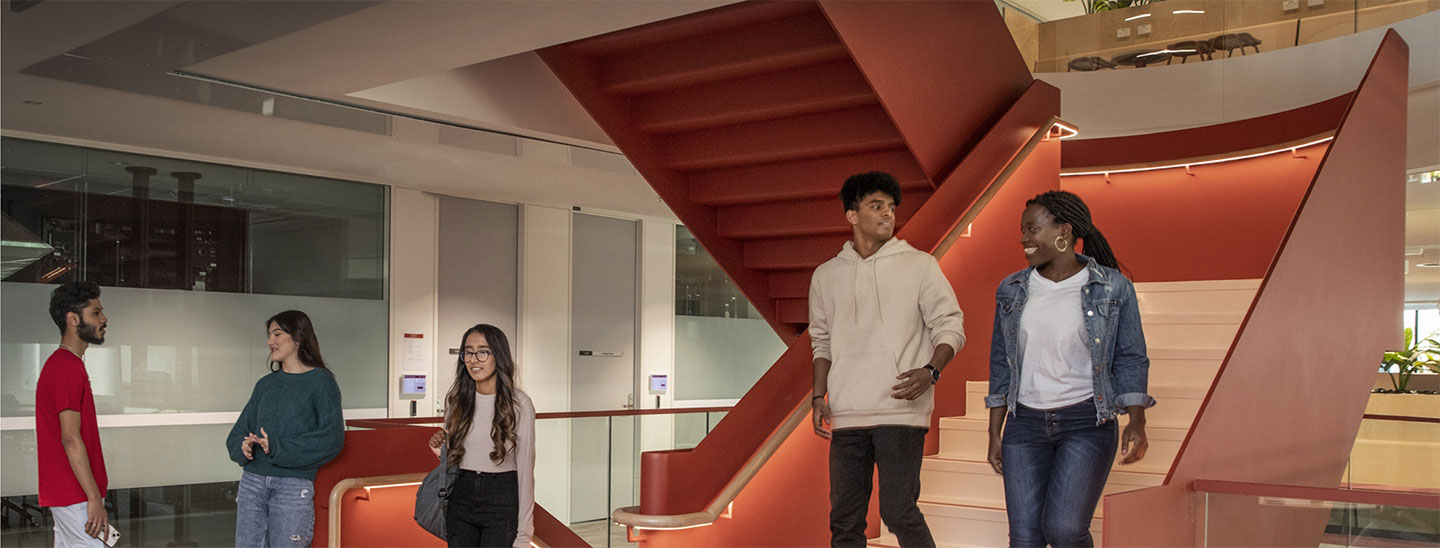 Student on campus staircase