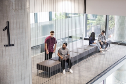 Students on campus sitting socialising