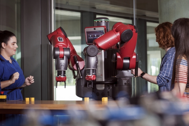 Students on campus studying machinery