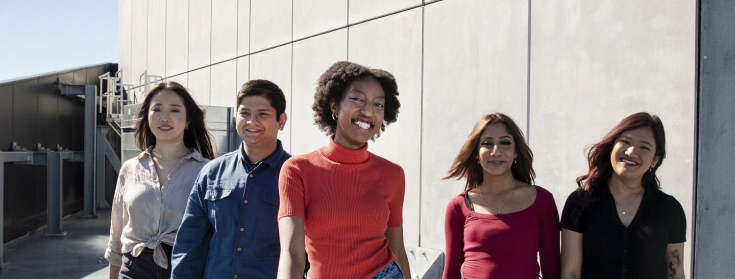 Students outside walking together happy